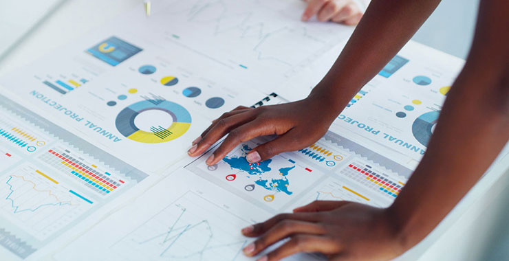 Data analyst working with multiple data visualization dashboards